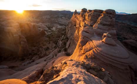 Arches National Park is a red rock paradise — and also a very popular destination. Early morning and late afternoon typically offer fewer crowds, shorter lines, easier parking, cooler temperatures and “golden light” for photographers.