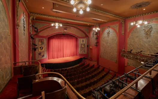 After extensive modern renovations, the Caine Lyric Theater seats 374 guests and still features a proscenium arch with a coat-of-arms from countries including England, Holland, Denmark, Spain and Germany.