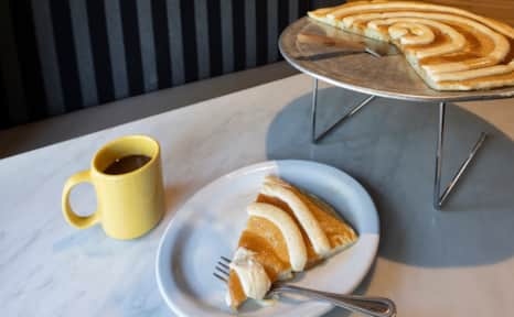 Herm’s is known for its iconic 16” cinnamon swirl pancake.