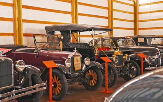 The museum includes Erickson’s more than 150 motorcycles dating to the 1900s, a collection of dozens of classic cars, 120 farm tractors, and a belt-driven sawmill.