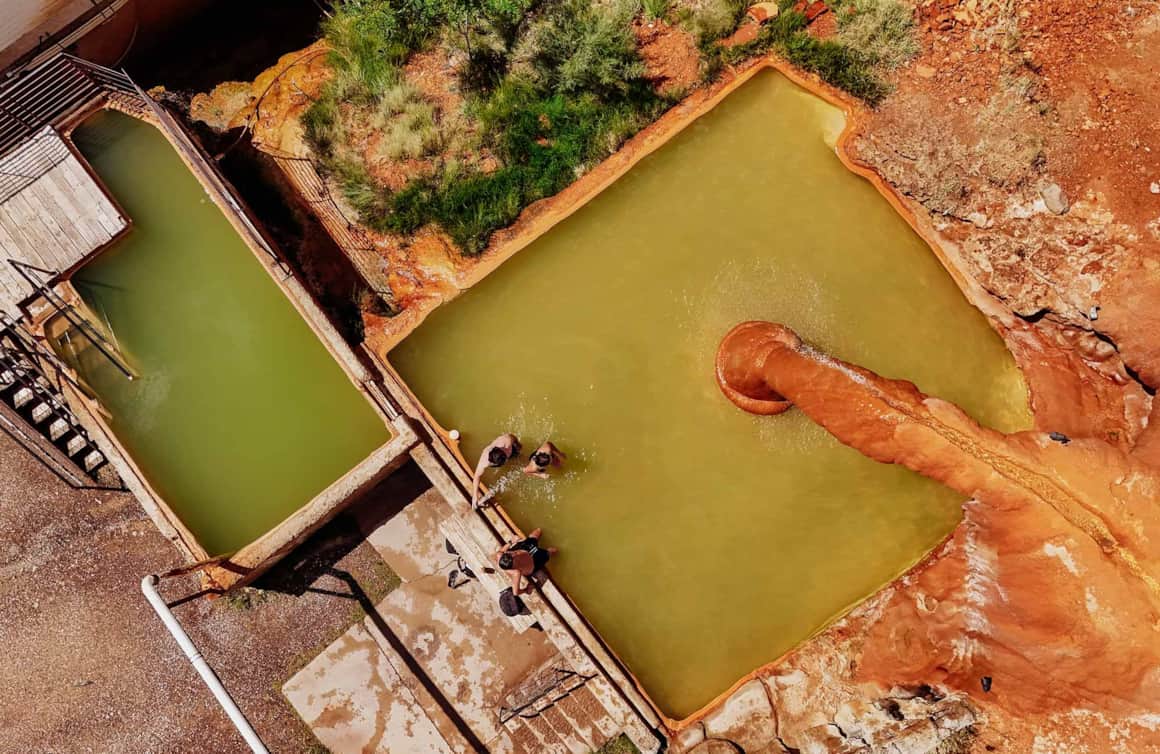 The Mystic Hot Springs feature soaking areas, grassy tent campsites, pioneer cabins, tropical fish ponds and options to get out hiking and biking in this former resting site of the Old Spanish Trail.