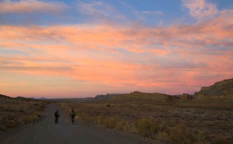 Pedaling into the desert sunset