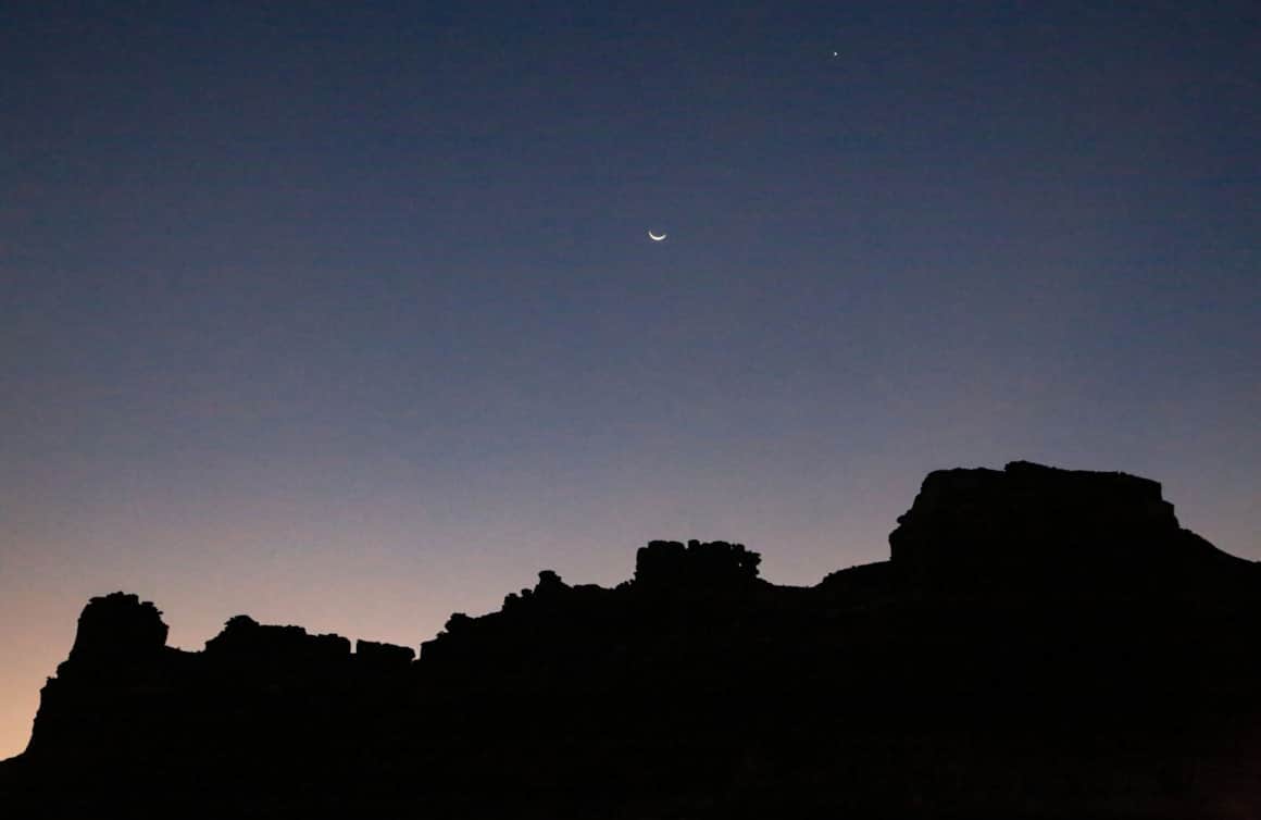 The moon rises over Glen Canyon National Recreation Area near Hite