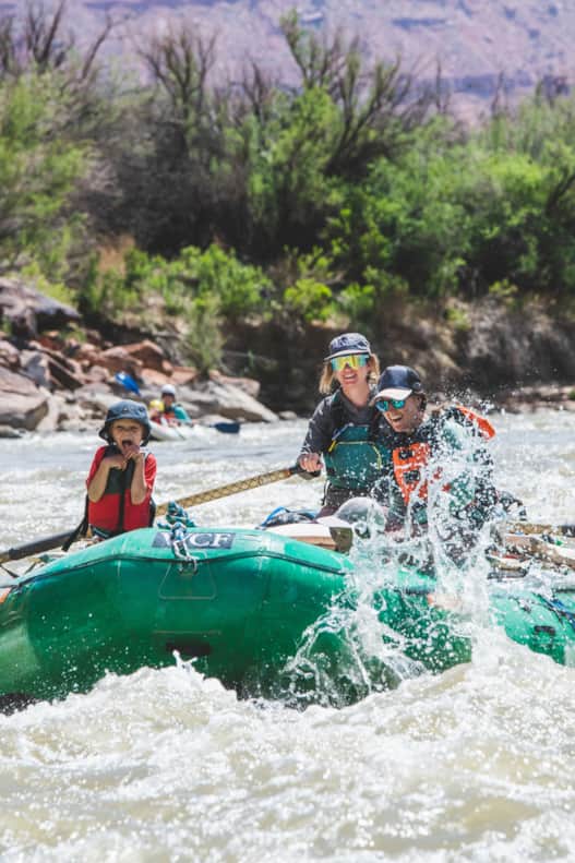 Caitlin Bognaski (center) rafting with her family in Moab.