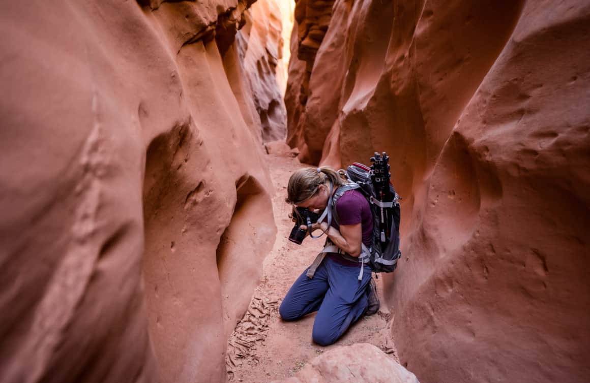 Author Angie Payne ditches the tripod in favor of freedom and quickness of movement while on a shoot in Moonshine Wash slot canyon.