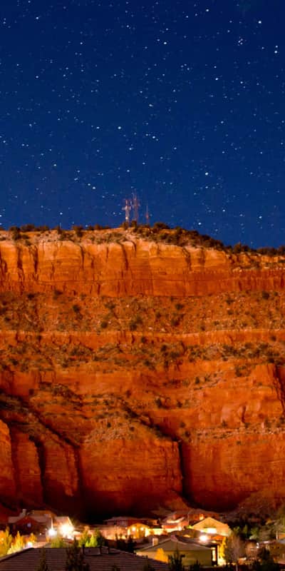 Sandstone cliffs surround the Western adventure base camp town of Kanab, Utah.