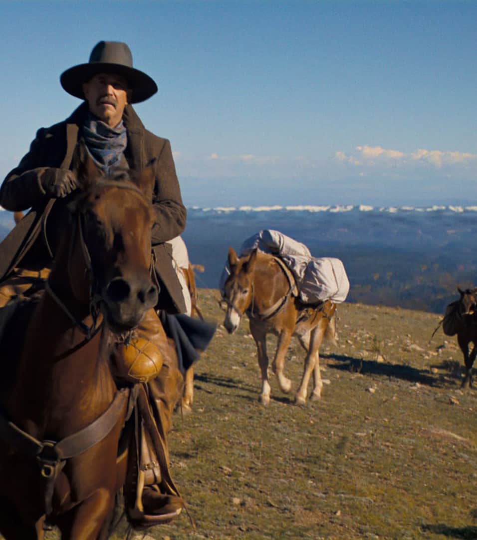 Kevin Costner rides a horse across a Southern Utah mountain range in the film, "Horizon: An American Saga."