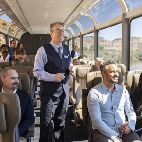 The Rocky Mountaineer coaches feature oversized glass-dome windows, an outdoor viewing area and are attended by hosts with stories about the route's historic sites, scenery and wildlife.