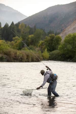 Fisherman fly fishing in the Provo River.