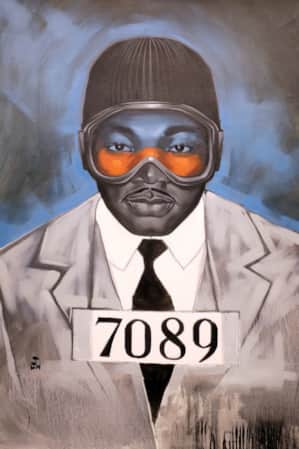 A drawing of a man wearing a suit and goggles.