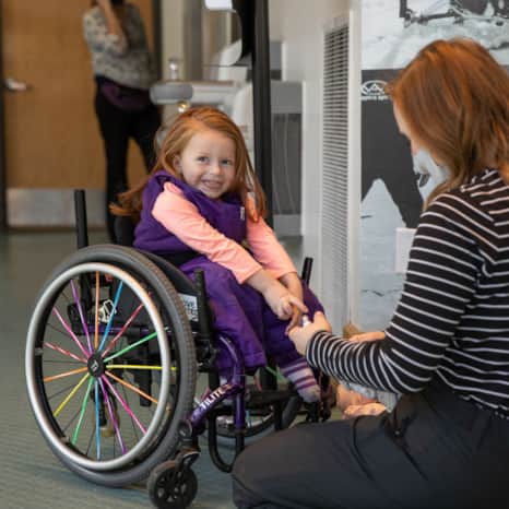 Millie gets suited up at Wasatch Adaptive Sports, located at Snowbird Ski and Summer Resort.