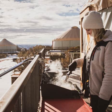 Some yurts come equipped with amenities like outdoor grills.